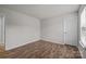 Bedroom with wood flooring, window, and white painted walls at 1814 Still Water Ln, Fort Mill, SC 29707