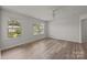 A bedroom with wood floors, a ceiling fan and two windows allowing for natural light at 1814 Still Water Ln, Fort Mill, SC 29707