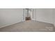 Neutral bedroom featuring carpeted floors and French doors at 1814 Still Water Ln, Fort Mill, SC 29707