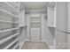 Walk-in closet with extensive built-in shelving and drawers, providing ample storage at 1814 Still Water Ln, Fort Mill, SC 29707