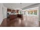 Open floor plan with kitchen, breakfast nook, hardwood floors, and lots of windows at 1814 Still Water Ln, Fort Mill, SC 29707