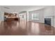 Open floor plan with kitchen, living room, fireplace, hardwood floors, and lots of natural light at 1814 Still Water Ln, Fort Mill, SC 29707