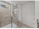 Luxurious shower with tile surround, glass door, and built-in niches at 1814 Still Water Ln, Fort Mill, SC 29707