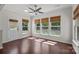 Sunroom with hardwood floors, a ceiling fan, a back door, and lots of natural light at 1814 Still Water Ln, Fort Mill, SC 29707