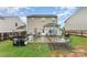 This cozy backyard features a patio area with grilling and dining space for outdoor enjoyment and entertaining at 189 Fesperman Cir, Troutman, NC 28166