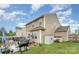 Fenced backyard featuring a stone patio with an outdoor kitchen and dining area perfect for entertaining at 189 Fesperman Cir, Troutman, NC 28166