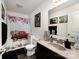 Bright bathroom featuring a red truck themed shower curtain, modern vanity, and ample lighting at 189 Fesperman Cir, Troutman, NC 28166