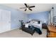 Calm bedroom featuring soft blue walls, a cozy upholstered bed, and an exercise bike to stay in shape at 189 Fesperman Cir, Troutman, NC 28166