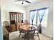 Dining room with a wooden dining table, wood hutch, and natural light at 189 Fesperman Cir, Troutman, NC 28166