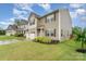 Well-maintained two-story home with a lush green lawn, mature landscaping, and charming curb appeal at 189 Fesperman Cir, Troutman, NC 28166