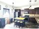 Beautiful kitchen with stainless steel appliances, dark cabinetry, and a center island with barstool seating at 189 Fesperman Cir, Troutman, NC 28166