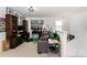 Cozy living room featuring a gray sofa, wood cabinets, and decor at 189 Fesperman Cir, Troutman, NC 28166