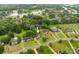 Aerial view of a home near the Rolling Hills Country Club and Golf Course with a pond at 1912 Windmere Dr, Monroe, NC 28110