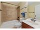 Tiled bathroom with a bathtub, shower, and vanity at 1912 Windmere Dr, Monroe, NC 28110