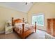 Bedroom featuring natural light from the window, matching nightstands and hardwood furniture at 1912 Windmere Dr, Monroe, NC 28110