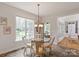 Cozy breakfast nook featuring a round table, a window, and tile flooring at 1912 Windmere Dr, Monroe, NC 28110