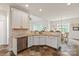 Corner kitchen view with stainless steel appliances and access to breakfast nook at 1912 Windmere Dr, Monroe, NC 28110