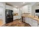 Bright kitchen with stainless steel appliances, white cabinets and tiled backsplash at 1912 Windmere Dr, Monroe, NC 28110