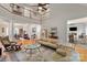 Open-concept living room with a view of the dining area and an upstairs balcony at 1912 Windmere Dr, Monroe, NC 28110