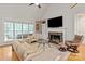 Comfortable living room with fireplace and backyard views at 1912 Windmere Dr, Monroe, NC 28110