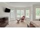 Main bedroom featuring a large window and a comfortable seating area at 1912 Windmere Dr, Monroe, NC 28110