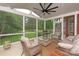 Relaxing screened-in porch featuring comfortable seating and a ceiling fan at 1912 Windmere Dr, Monroe, NC 28110