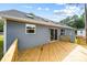 View of back exterior featuring a wooden deck with stairs leading to the backyard at 2027 Marquesas Ave, Tega Cay, SC 29708