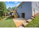 Home exterior with a back porch, stairs to a small deck and a concrete patio at 2027 Marquesas Ave, Tega Cay, SC 29708