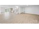 Finished basement features a wet bar, staircase, and laminate flooring at 2027 Marquesas Ave, Tega Cay, SC 29708
