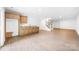 Spacious basement features a wet bar, staircase, and neutral color scheme at 2027 Marquesas Ave, Tega Cay, SC 29708