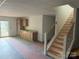 Unfinished basement with a kitchenette and a staircase leading to the upper level at 2027 Marquesas Ave, Tega Cay, SC 29708