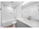 Modern bathroom features a tiled shower/bath, stylish vanity with marble countertop, and a neutral color palette at 2027 Marquesas Ave, Tega Cay, SC 29708