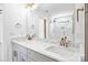 Stylish bathroom featuring a double vanity, marble countertops, and glass shower at 2027 Marquesas Ave, Tega Cay, SC 29708