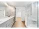 Bright bathroom featuring a glass shower, double vanity, and modern fixtures at 2027 Marquesas Ave, Tega Cay, SC 29708
