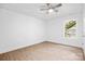 Bright bedroom featuring a ceiling fan, wood-look flooring, and a window with natural light at 2027 Marquesas Ave, Tega Cay, SC 29708