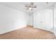Bedroom featuring wood-look floors, a ceiling fan, and a closet with double doors at 2027 Marquesas Ave, Tega Cay, SC 29708