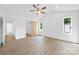 Well-lit bedroom with a barn door to the bathroom and two windows at 2027 Marquesas Ave, Tega Cay, SC 29708
