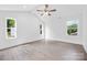 Large bedroom features three windows, natural light, and neutral colors at 2027 Marquesas Ave, Tega Cay, SC 29708
