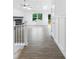 Bright entryway with wood-look floors, leading to an open living space and outdoor deck at 2027 Marquesas Ave, Tega Cay, SC 29708