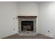 New fireplace with shiplap accent wall and a rustic wooden mantle, perfect for cozy evenings at 2027 Marquesas Ave, Tega Cay, SC 29708