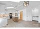 Spacious kitchen with skylights, white cabinets, stainless steel appliances, and a center island at 2027 Marquesas Ave, Tega Cay, SC 29708