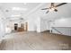 Spacious living room with a kitchen, lots of natural light, and modern finishes at 2027 Marquesas Ave, Tega Cay, SC 29708