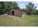 Exterior view of a versatile outbuilding on a property, offering potential for various uses and storage at 2291 Howell Rd, Midland, NC 28107