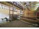 Interior view of a well-equipped barn with goats, and functional livestock fixtures, ready for agricultural use at 2291 Howell Rd, Midland, NC 28107