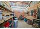 Organized storage area in barn, showcasing ample space, shelving and assorted supplies for efficient maintenance at 2291 Howell Rd, Midland, NC 28107