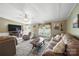 Inviting living room with a decorative fireplace, large windows, and comfortable, stylish furnishings at 2291 Howell Rd, Midland, NC 28107