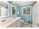 Bathroom featuring double sink vanity, neutral wall color, a tiled shower and bright window at 240 China Grove Rd, China Grove, NC 28123