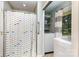 Bathroom featuring shower stall, laundry nook, and window at 240 China Grove Rd, China Grove, NC 28123