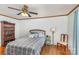 Bedroom with wood floors, wood trim and paneled wall, with hardwood floors at 240 China Grove Rd, China Grove, NC 28123