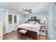 Bright bedroom with hardwood floors, ceiling fan, and natural light from the double windows at 240 China Grove Rd, China Grove, NC 28123